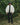 Cream padded bomber jacket worn with black pants; stand collar and quilted padding