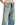 Washed blue distressed baggy jeans with drawstring waist, relaxed straight fit.