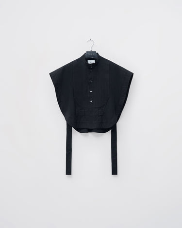 Black tuxedo vest shirt with pleated front, button placket, and long waist ties