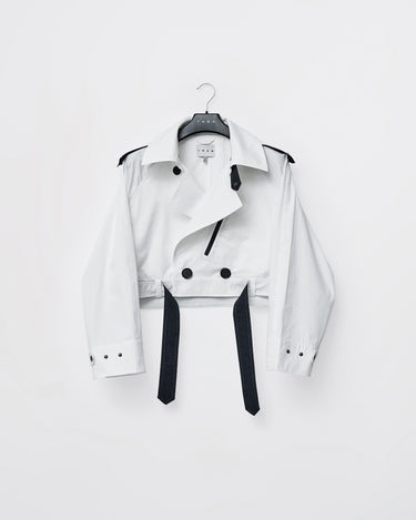 Cropped trench jacket garment on hanger in white with black strap accents and snap buttons