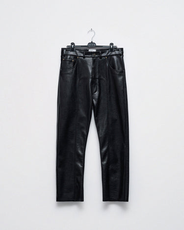 Pair of black faux-leather trousers hanging, straight leg with belt loops