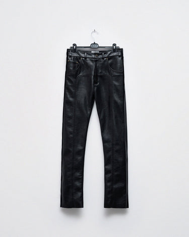 Black leather-look ugly trousers hanging on a hanger, straight-leg style