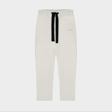 Cream cropped sweatpants with black drawstring and Theo logo on right thigh