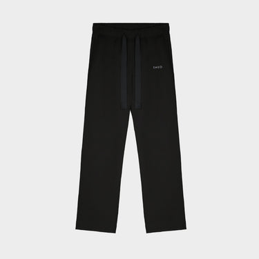 Black straight-leg sweatpants with drawstring waist and Theo logo