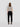 Black cropped sweatpants with drawstring waist; model wearing them from the back.