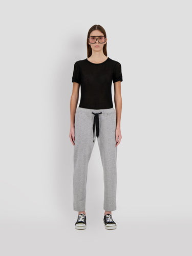 Cropped gray sweatpants with black drawstring tie and ribbed ankle cuffs