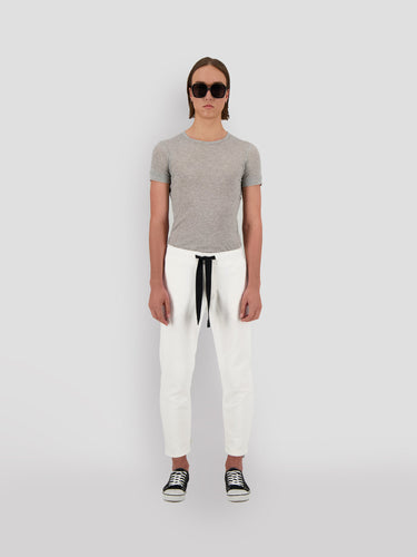 Cropped white sweatpants with black drawstring tie and Theo logo detail