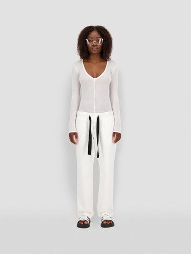 White straight-leg sweatpants with black drawstring and side pockets