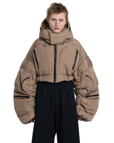 Cropped puffer jacket with hood, taupe insulated body and navy lower panel