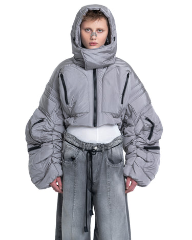 Gray cropped puffer jacket with attached hood and zip-front, front view