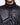 Black puffer jacket detail with high drawcord collar and snap-button front