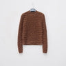 Brown cable-knit sweater with crew neck and long sleeves