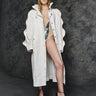 White long balmacaan coat with button front and open collar, front full-length
