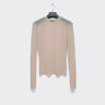 Nude sheer mesh long-sleeve turtleneck top on a hanger