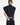 Black cropped tuxedo shirt with wide shoulders, a pleated bib, and button front