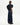 Black sleeveless tuxedo shirt shown from the back, with long waist ties