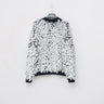 Ivory shred sweater with black flecks, crew neck, long fringed sleeves, textured knit