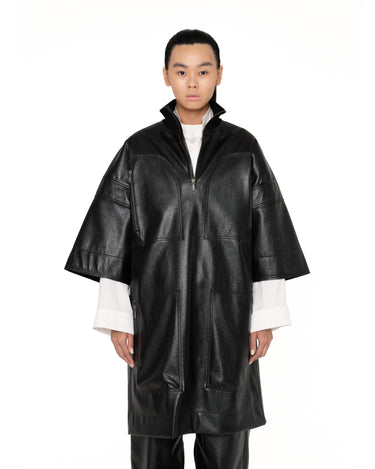 Dark short-sleeve anorak jacket with half-zip front and two chest patch pockets