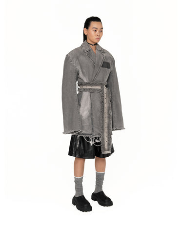 Gray distressed jacket dress with long draped silhouette, belt tie, and frayed trim