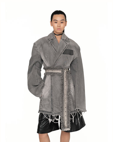 Gray distressed jacket dress with pocket detail, belt tie, and raw-edged layered lower hem
