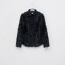 Black fringed texture shirt with long sleeves and a button front, shown on a hanger.