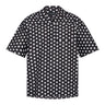 Black camp shirt with white dot print, short sleeves and button-front placket.