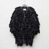 CORVUS wing coat on hanger, black textured layered design with high collar and buttonless front