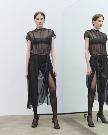 Black sheer dress with cap sleeves, high neck, and draped waist tie detail