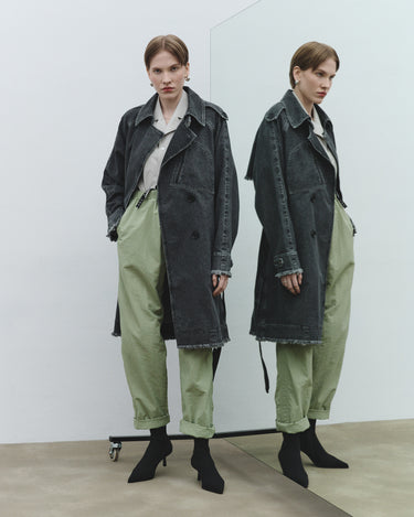 Faded trench coat in dark gray with notched lapels, button front, and waist tie belt.