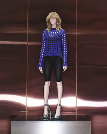 Blue lattice-knit sweater with round neckline and long sleeves