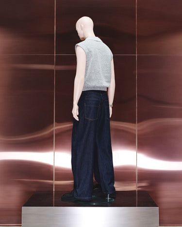Dark navy men’s jeans on mannequin, straight wide-leg cut with button fly
