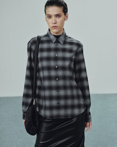 Grey plaid button-up shirt with pointed collar and dark button placket