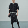 Black shredded sweater with short sleeves and crew neck