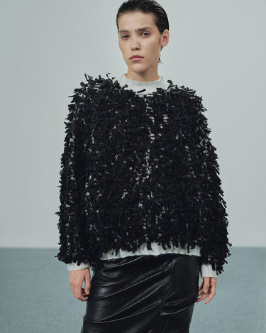 Black shredded sweater with crew neck and textured fringe