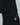 Black blazer sleeve with three cuff buttons and a plaid shirt cuff beneath