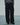 Front view of black wide-leg trousers with pleats and side pockets