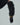 Black leather glove with a long, textured ruffled cuff and olive knit trim