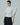 White tuxedo vest shirt with cape sleeves, pleated bib and cropped waist