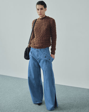 Brown cable-knit sweater with crew neck and long sleeves, textured knit