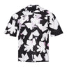Black-and-white printed camp shirt close-up of button placket and fold collar.