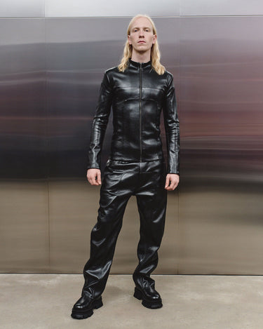 Men's black faux-leather trousers with front zip fly and straight legs