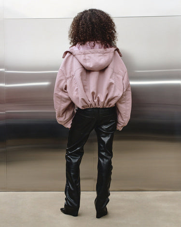 Black leather-look ugly trousers shown from the back with belt loops