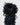 Close-up of a black glove cuff with layered ruffles and olive knit texture