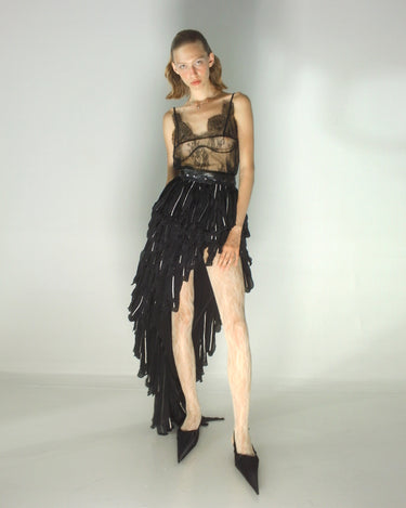 Corvus wing skirt, black layered wing fringe panels on model
