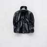 Black cropped eco-leather cape with high hooded collar and front snap buttons
