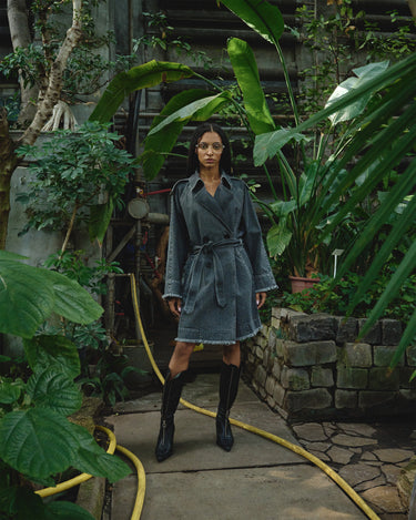 Gray denim belted trench coat with notched lapels and layered front pockets
