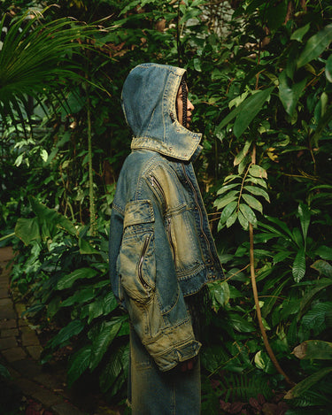 Faded denim hooded jacket with side flap pockets and buttoned sleeve cuffs