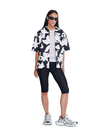 Black-and-white abstract printed camp shirt, short sleeves, button-up front.