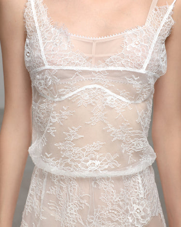White lace slip dress with sheer mesh, floral embroidery, and scalloped trim