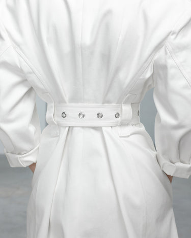 Ivory denim jacket dress with cinched waist belt and metal eyelet buttons